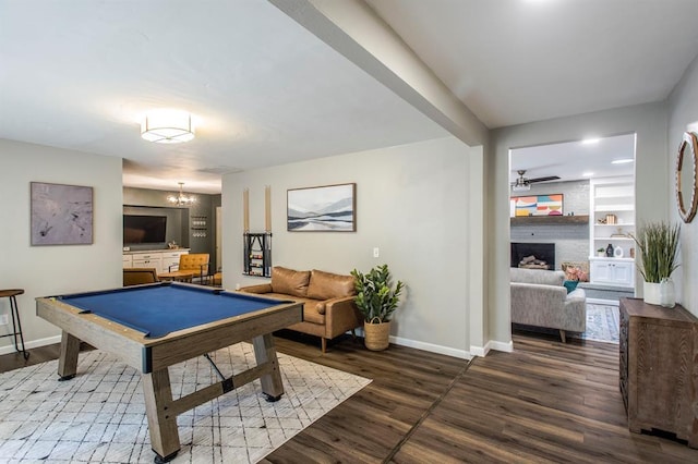 9800 Hummingbird Ln, Oklahoma City, OK 73162 - rec room with baseboards, wood finished floors, billiards, a large fireplace, and ceiling fan