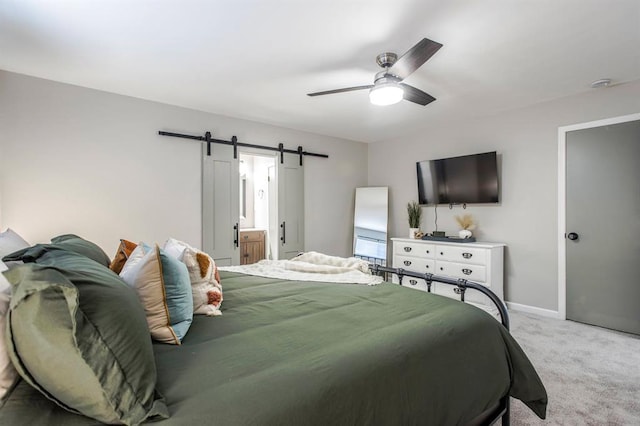 9800 Hummingbird Ln, Oklahoma City, OK 73162 - bedroom featuring carpet, a barn door, a ceiling fan, and baseboards