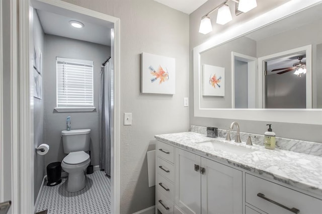 9800 Hummingbird Ln, Oklahoma City, OK 73162 - full bath with vanity, toilet, a ceiling fan, and baseboards
