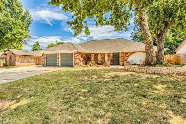 9800 Hummingbird Ln, Oklahoma City, OK 73162 - ranch-style home featuring a garage and concrete driveway