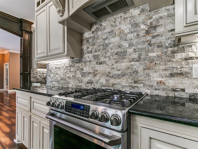 4216 SE 86th Pl, Oklahoma City, OK 73135 - kitchen featuring stainless steel range with gas cooktop, backsplash, dark wood finished floors, ventilation hood, and crown molding