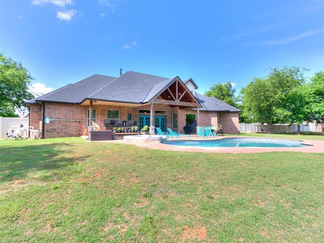 4216 SE 86th Pl, Oklahoma City, OK 73135 - back of property featuring brick siding, a patio area, and roof with shingles
