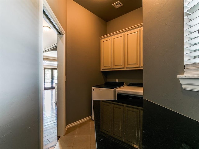 4216 SE 86th Pl, Oklahoma City, OK 73135 - laundry room with cabinet space, washer and clothes dryer, and light tile patterned floors
