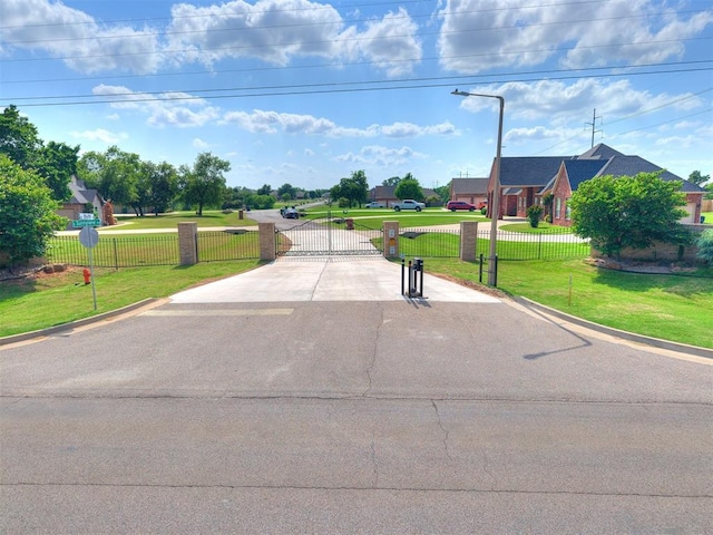 4216 SE 86th Pl, Oklahoma City, OK 73135 - view of street featuring a gate, street lights, and curbs