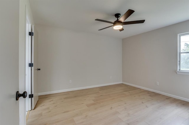 812 NW 113th St, Oklahoma City, OK 73114 - empty room with ceiling fan, light wood-type flooring, and baseboards