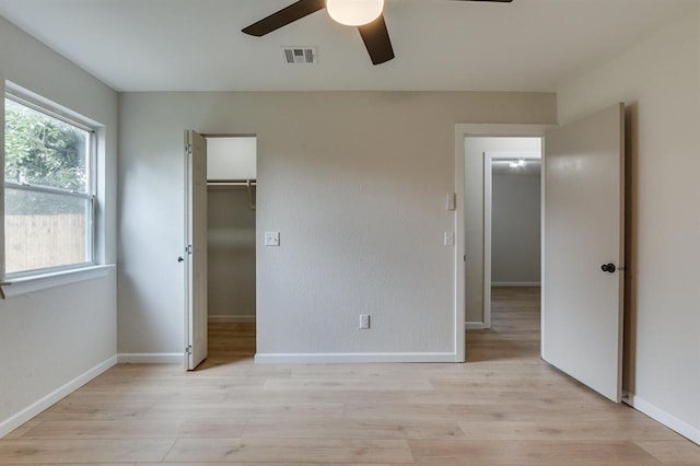 812 NW 113th St, Oklahoma City, OK 73114 - unfurnished bedroom with light wood-type flooring, baseboards, and a ceiling fan