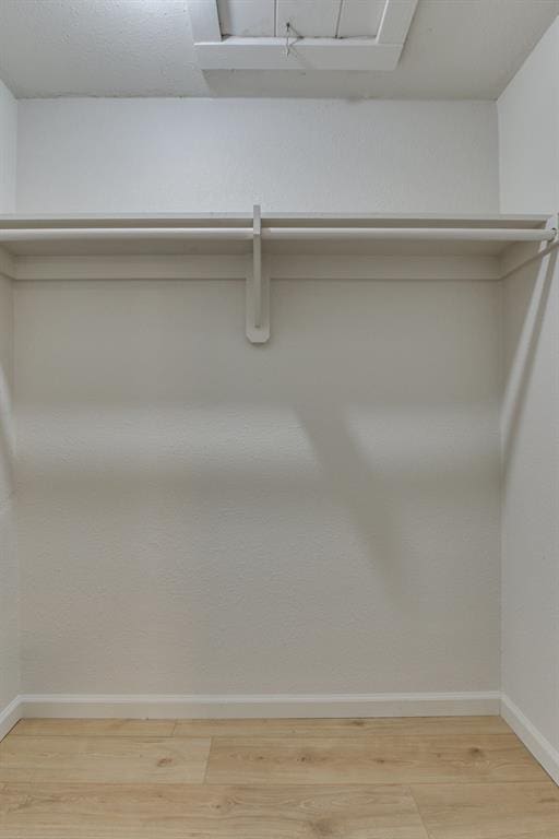 812 NW 113th St, Oklahoma City, OK 73114 - spacious closet featuring light wood finished floors
