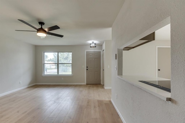 812 NW 113th St, Oklahoma City, OK 73114 - foyer featuring light wood-type flooring, a ceiling fan, and baseboards