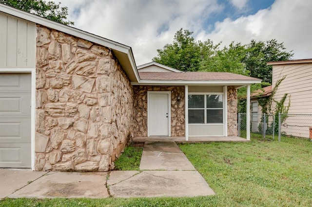 812 NW 113th St, Oklahoma City, OK 73114 - view of exterior entry featuring stone siding and a garage