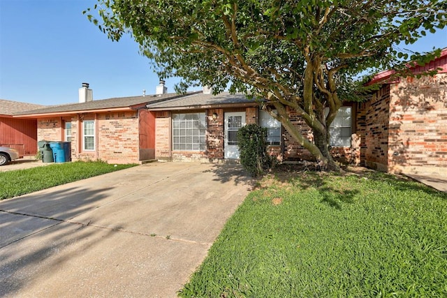 201 Kathleen Dr, Midwest City, OK 73110 - ranch-style home with brick siding, a front yard, and a chimney