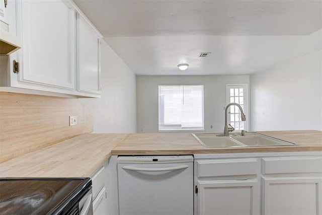 201 Kathleen Dr, Midwest City, OK 73110 - kitchen with white dishwasher, a sink, light countertops, and white cabinets