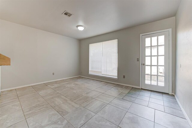 201 Kathleen Dr, Midwest City, OK 73110 - spare room featuring light tile patterned floors and baseboards