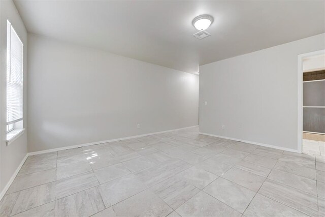 201 Kathleen Dr, Midwest City, OK 73110 - empty room featuring baseboards