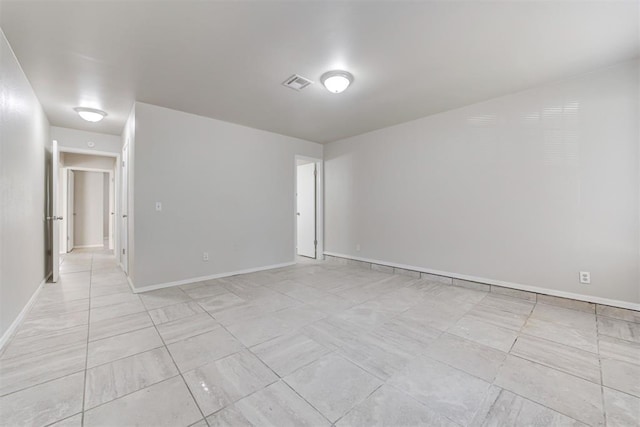 201 Kathleen Dr, Midwest City, OK 73110 - empty room featuring light tile patterned flooring and baseboards