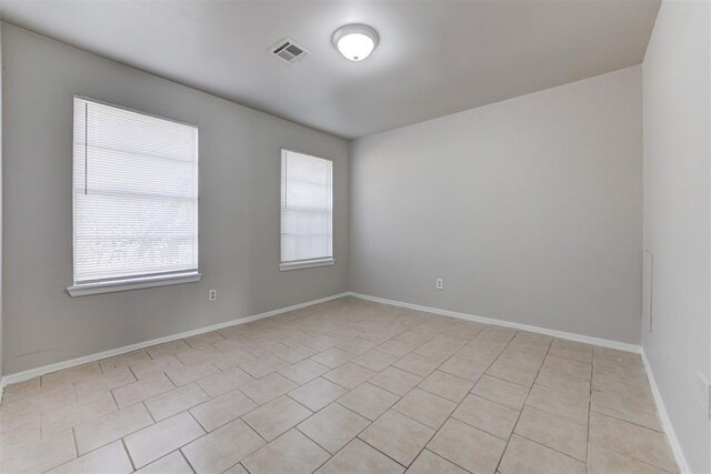 201 Kathleen Dr, Midwest City, OK 73110 - unfurnished room with light tile patterned floors and baseboards
