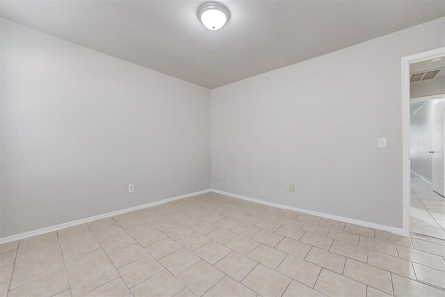 201 Kathleen Dr, Midwest City, OK 73110 - unfurnished room featuring baseboards and light tile patterned flooring
