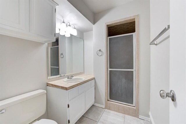 201 Kathleen Dr, Midwest City, OK 73110 - full bathroom with a shower stall, vanity, toilet, and tile patterned flooring