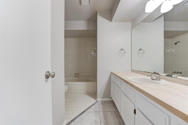 201 Kathleen Dr, Midwest City, OK 73110 - full bath with vanity, toilet, tile patterned flooring,  shower combination, and baseboards