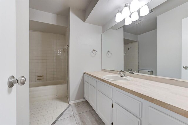 201 Kathleen Dr, Midwest City, OK 73110 - bathroom with vanity, tile patterned flooring, shower / washtub combination, baseboards, and a chandelier