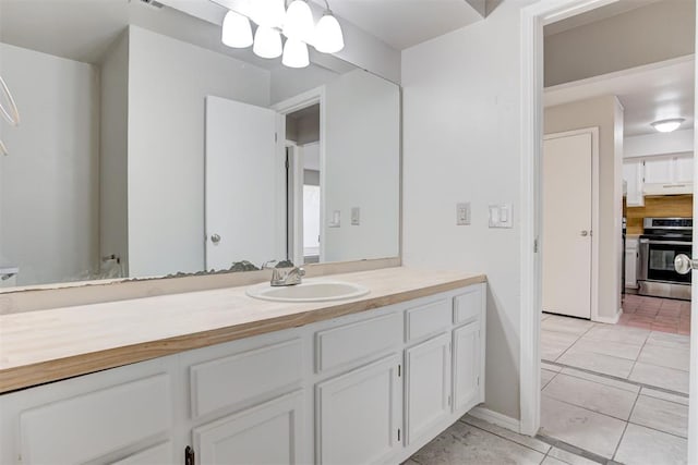 201 Kathleen Dr, Midwest City, OK 73110 - bathroom with vanity, tile patterned floors, and baseboards