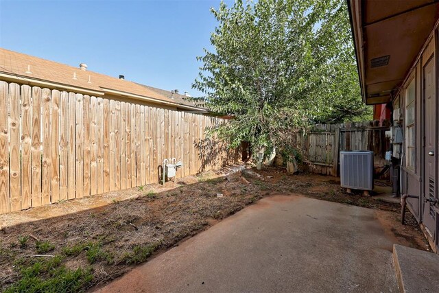 201 Kathleen Dr, Midwest City, OK 73110 - fenced backyard with central AC unit and a patio