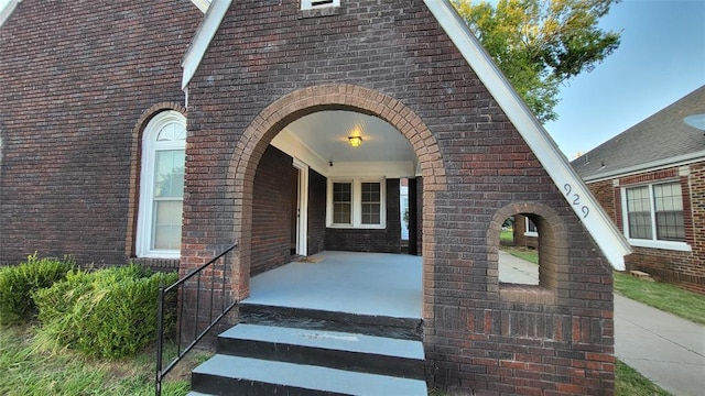 929 NE 21st St, Oklahoma City, OK 73105 - view of exterior entry featuring brick siding and covered porch