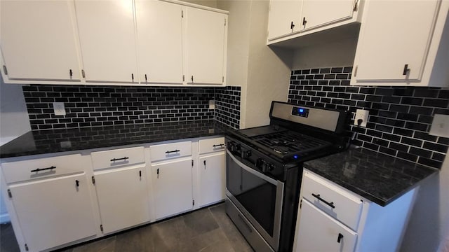 929 NE 21st St, Oklahoma City, OK 73105 - kitchen with stainless steel gas stove, decorative backsplash, and white cabinetry