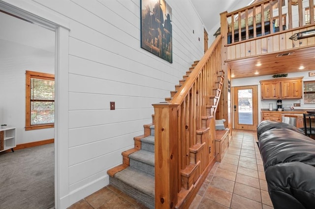 83 Bobber Rd, Broken Bow, OK 74728 - stairway with baseboards and wood walls