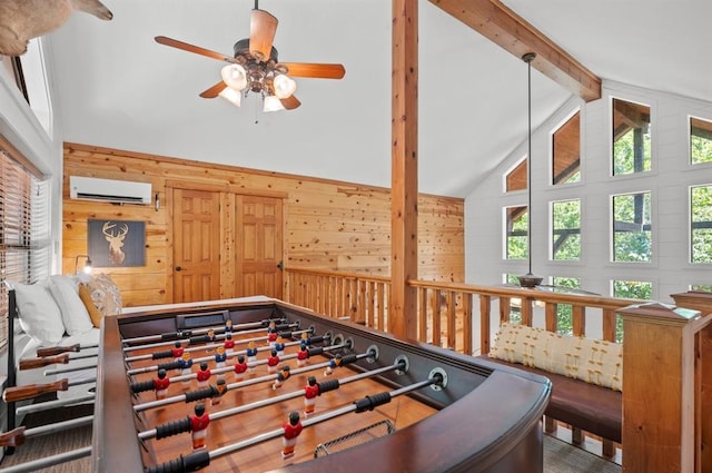 83 Bobber Rd, Broken Bow, OK 74728 - game room with ceiling fan, beam ceiling, wood walls, high vaulted ceiling, and a wall mounted air conditioner