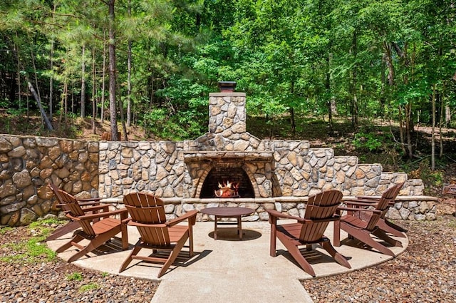 83 Bobber Rd, Broken Bow, OK 74728 - view of patio / terrace featuring an outdoor stone fireplace