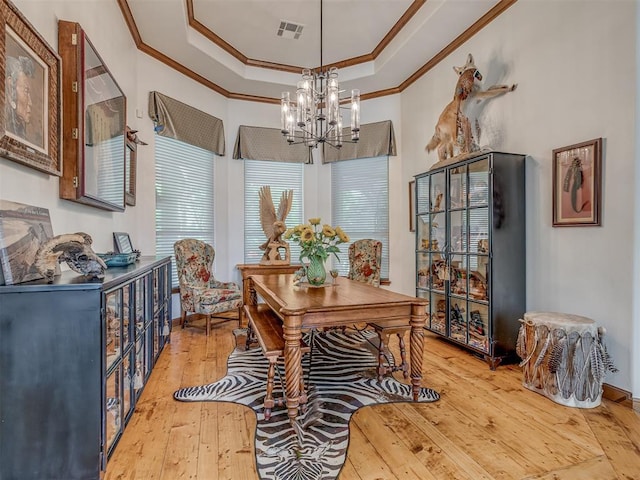 3122 Thornbrooke Blvd, Edmond, OK 73013 - dining area with crown molding, a chandelier, light wood finished floors, a tray ceiling, and baseboards