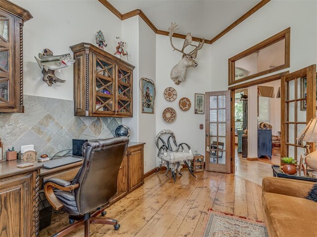 3122 Thornbrooke Blvd, Edmond, OK 73013 - office area featuring crown molding, french doors, and light wood-type flooring