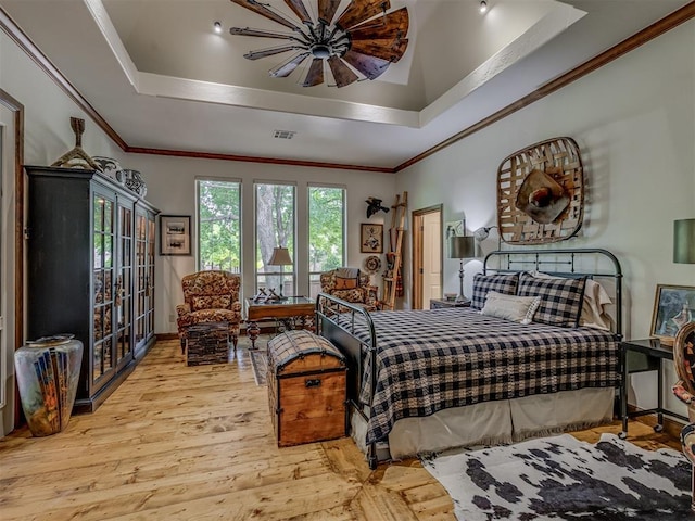 3122 Thornbrooke Blvd, Edmond, OK 73013 - bedroom with crown molding, a raised ceiling, wood finished floors, and ceiling fan