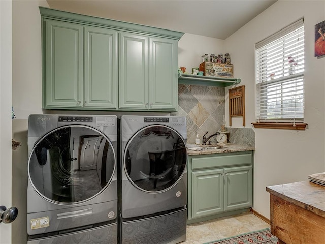 3122 Thornbrooke Blvd, Edmond, OK 73013 - laundry area with cabinet space and washing machine and dryer
