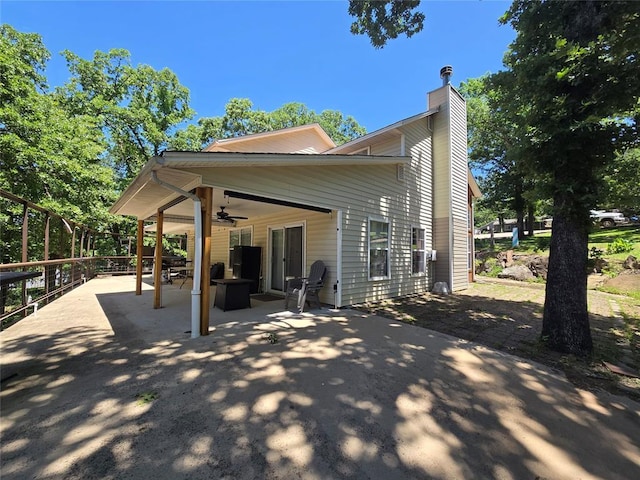 110534 S 4183rd Rd, Checotah, OK 74426 - rear view of house with a ceiling fan, a patio, and a chimney