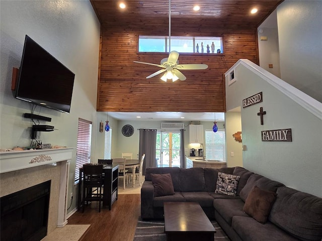 110534 S 4183rd Rd, Checotah, OK 74426 - living room featuring a high ceiling, ceiling fan, wood ceiling, recessed lighting, and a fireplace with flush hearth