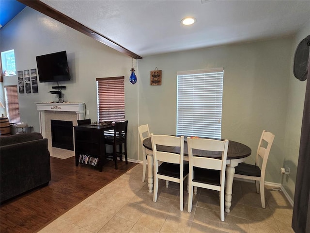 110534 S 4183rd Rd, Checotah, OK 74426 - tiled dining room with a fireplace with flush hearth, recessed lighting, baseboards, and plenty of natural light
