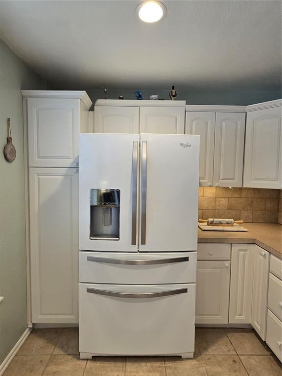 110534 S 4183rd Rd, Checotah, OK 74426 - kitchen featuring white refrigerator with ice dispenser, white cabinetry, and light countertops