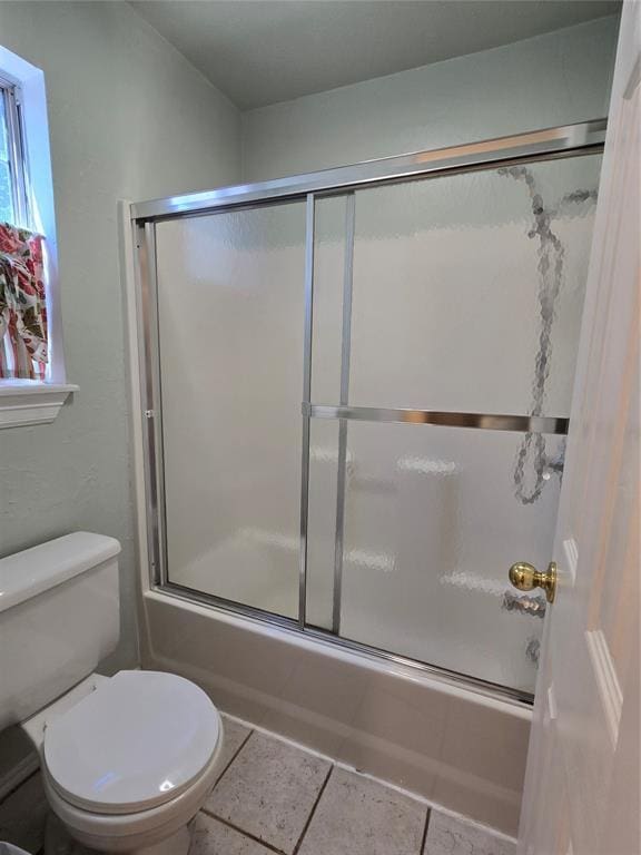 110534 S 4183rd Rd, Checotah, OK 74426 - full bathroom featuring combined bath / shower with glass door, toilet, and tile patterned flooring