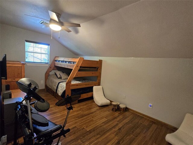 110534 S 4183rd Rd, Checotah, OK 74426 - bedroom featuring wood finished floors, vaulted ceiling, baseboards, and ceiling fan