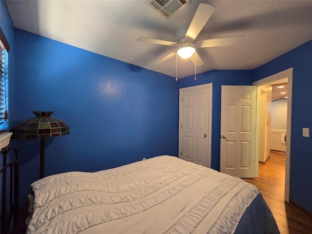 110534 S 4183rd Rd, Checotah, OK 74426 - bedroom featuring wood finished floors and a ceiling fan