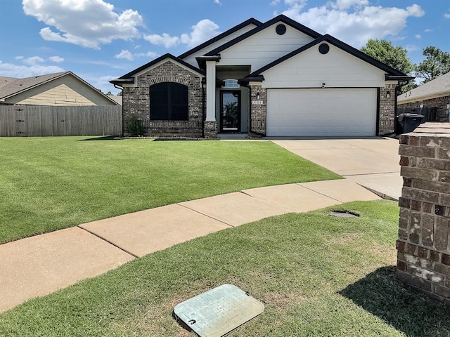 3105 SW 104th Ter, Oklahoma City, OK 73159 - view of front facade with concrete driveway, a garage, and brick siding