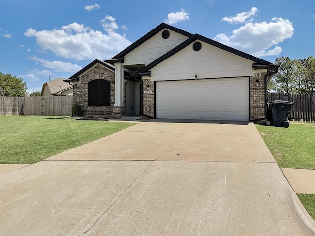 3105 SW 104th Ter, Oklahoma City, OK 73159 - ranch-style home featuring driveway, brick siding, and an attached garage