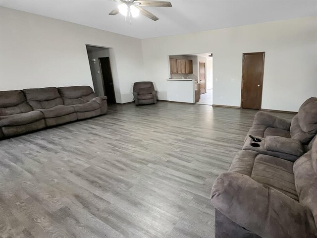 3105 SW 104th Ter, Oklahoma City, OK 73159 - living area with wood finished floors and a ceiling fan