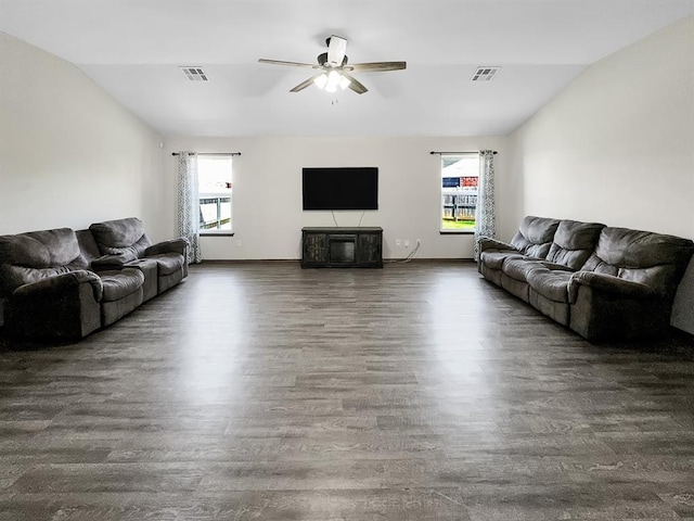 3105 SW 104th Ter, Oklahoma City, OK 73159 - living area with lofted ceiling, wood finished floors, a ceiling fan, and baseboards