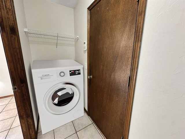 3105 SW 104th Ter, Oklahoma City, OK 73159 - washroom featuring washer / clothes dryer and light tile patterned flooring