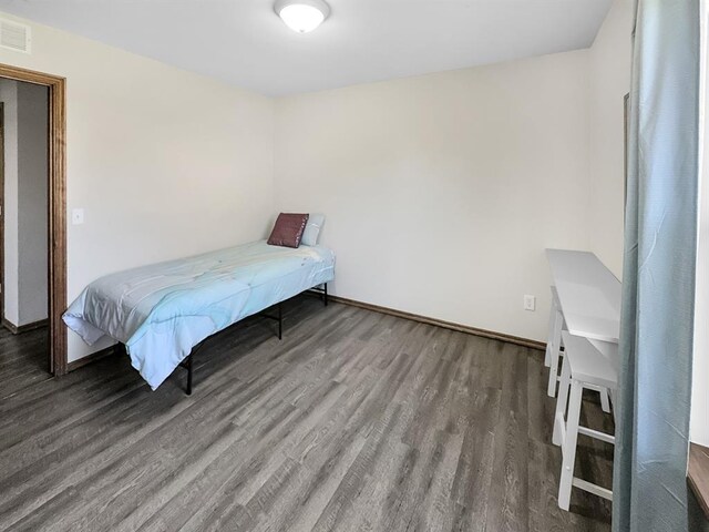3105 SW 104th Ter, Oklahoma City, OK 73159 - bedroom with wood finished floors and baseboards