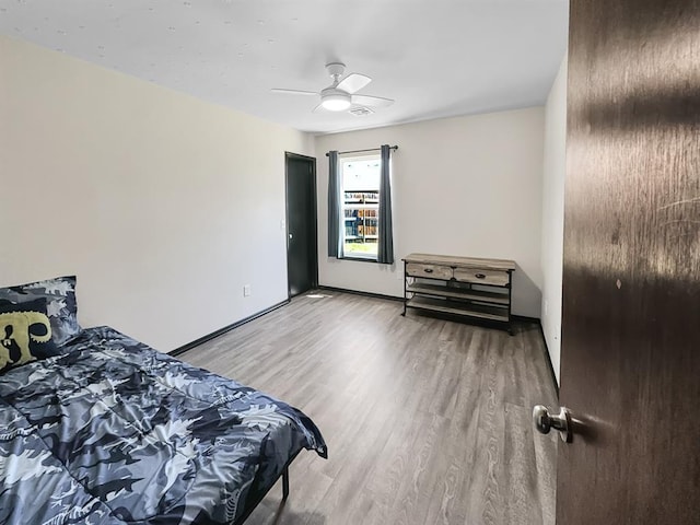 3105 SW 104th Ter, Oklahoma City, OK 73159 - bedroom with light wood-type flooring and ceiling fan