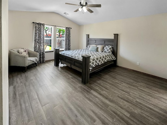 3105 SW 104th Ter, Oklahoma City, OK 73159 - bedroom featuring wood finished floors, lofted ceiling, a ceiling fan, and baseboards