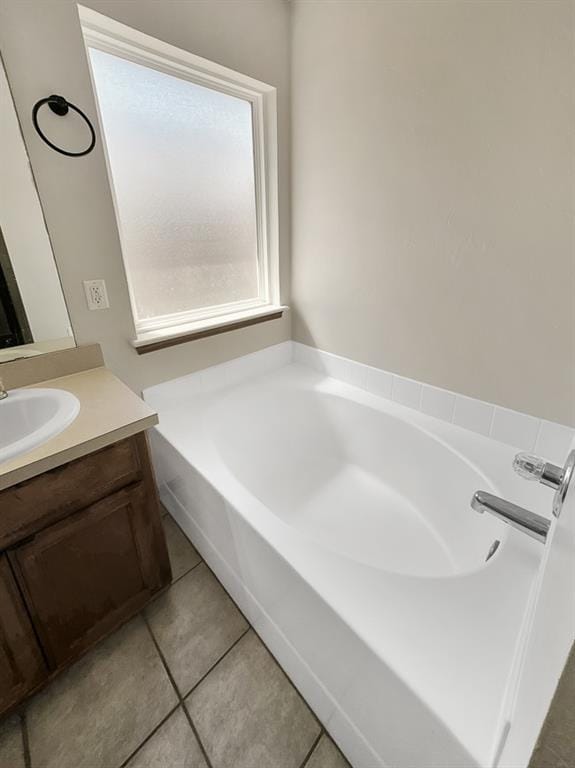 3105 SW 104th Ter, Oklahoma City, OK 73159 - full bath featuring a garden tub, vanity, and tile patterned floors